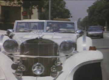 Excalibur Series IV Phaeton in W.B., Blue and the Bean (1989)