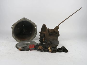 Early Ford V8 transmission, ring and pinion gear set, miscellaneous transmission parts, aluminum racing flywheel and Chevrolet bellhousing