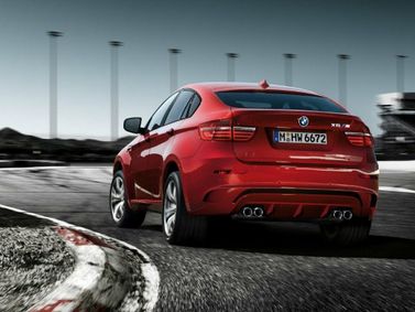 BMW X6 M I (E71) فيس ليفت، دفع رباعي 5 أبواب — منظر خلفي أيسر