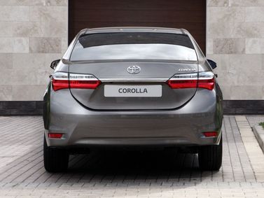 Toyota Corolla XI (E160, E170, E170, E180) فيس ليفت 1، سيدان — منظر خلفي