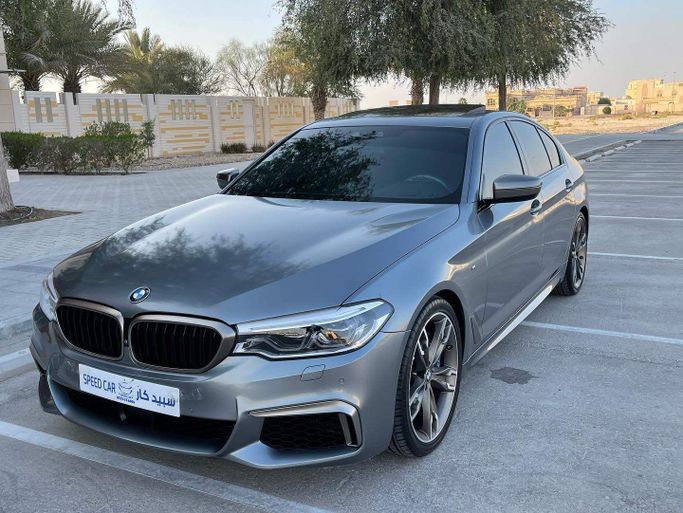 Used BMW 5 Series M550i xDrive VII (G30/G31), 4.4 l, 2019 in Abu Dhabi by Speed Car Motors, Grey color. GCC Specs | AUTO.AE
