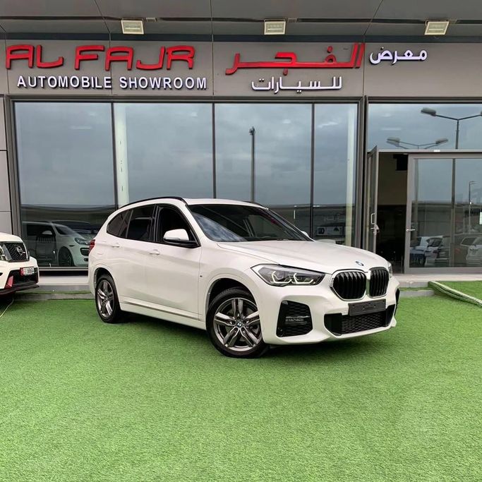 Used BMW X1 20i sDrive II (F48) Facelift, 2.0 l, 2021 in Abu Dhabi by Al Fajr Automobile showroom, White color. GCC Specs | AUTO.AE