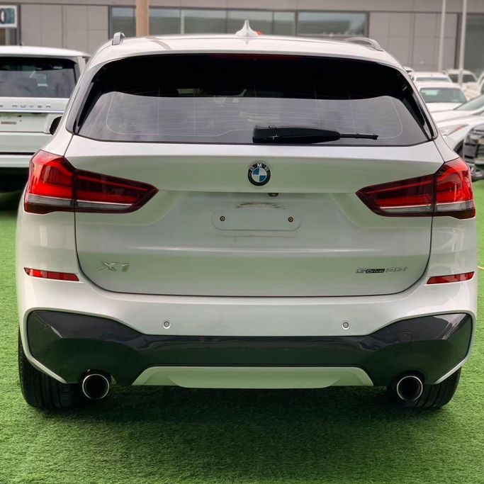 Used BMW X1 20i sDrive II (F48) Facelift, 2.0 l, 2021 in Abu Dhabi by Al Fajr Automobile showroom, White color. GCC Specs | AUTO.AE