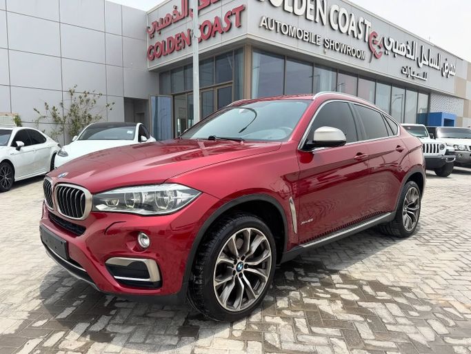 Used BMW X6 50i II (F16), 4.4 l, 2015 in Abu Dhabi by Golden coast automobile showroom, Red color. GCC Specs | AUTO.AE