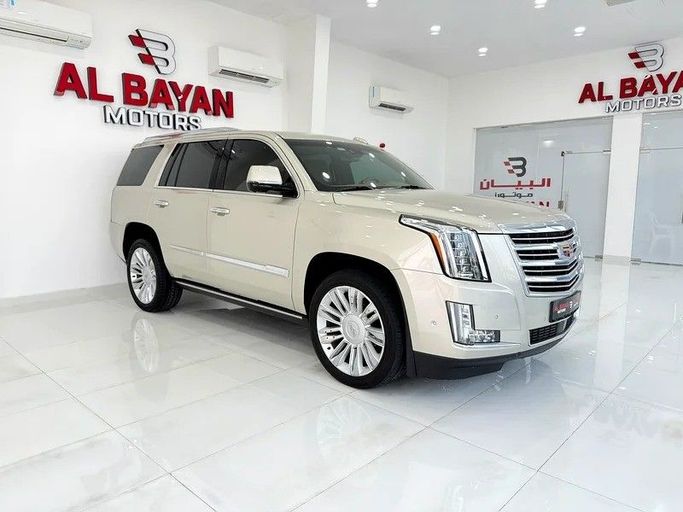 Used Cadillac Escalade IV, 6.2 l, 2017 in Abu Dhabi by Al Bayan Motors, Golden color. GCC Specs | AUTO.AE