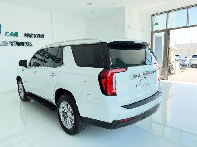 Подержанный GMC Yukon V, 3.0 л, 2021 в Абу-Даби от Speed Car Motors Белый цвет.  | AUTO.AE