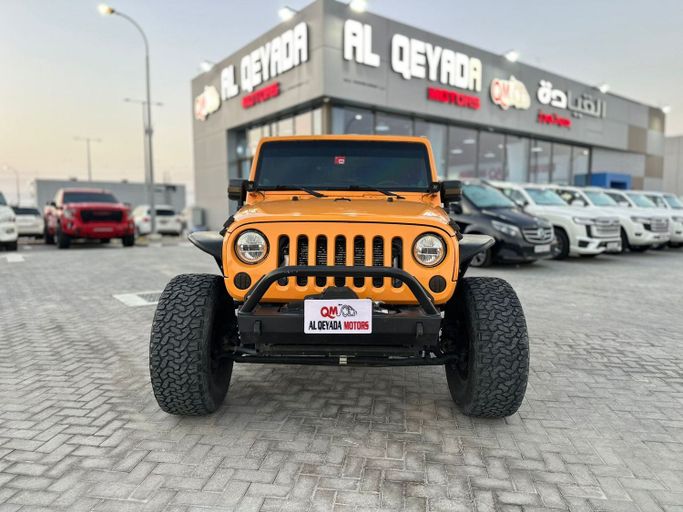 Used Jeep Wrangler III (JK), 3.6 l, 2013 in Abu Dhabi by Al Qeyada Motors, Orange color. American Specs | AUTO.AE
