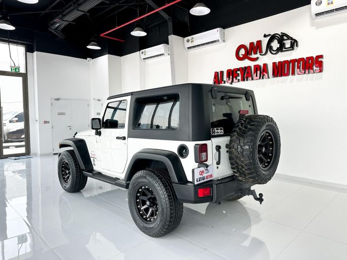 Used Jeep Wrangler III (JK), 3.6 l, 2010 in Abu Dhabi by Al Qeyada Motors, White color. GCC Specs | AUTO.AE