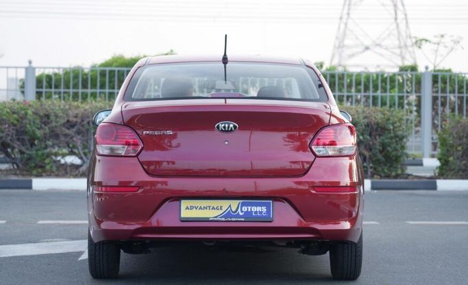 Подержанный Kia Pegas, 1.4 л, 2021 в Абу-Даби от Advantage Motors Красный цвет. GCC | AUTO.AE