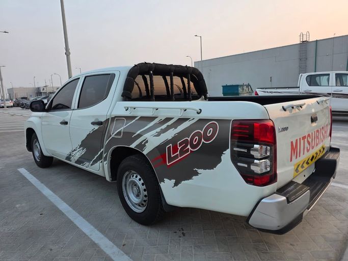 Подержанный Mitsubishi L200 V Рестайлинг, 2.4 л, 2020 в Абу-Даби от Diamond Waves Motors Белый цвет. Other | AUTO.AE