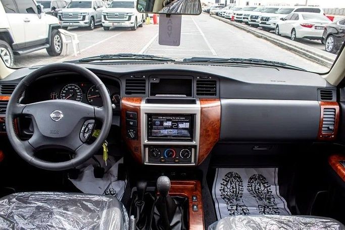 New Nissan Patrol V (Y61) Facelift, 4.8 l, 2024 in Abu Dhabi by Al Lulu Cars, Black color. GCC Specs | AUTO.AE