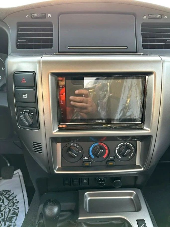 New Nissan Patrol V (Y61) Facelift, 4.8 l, 2024 in Abu Dhabi by Al Lulu Cars, White color. GCC Specs | AUTO.AE