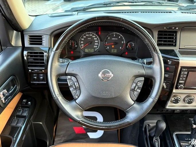 Used Nissan Patrol V (Y61) Facelift, 4.8 l, 2019 in Abu Dhabi by Al Bayan Motors, Golden color. GCC Specs | AUTO.AE