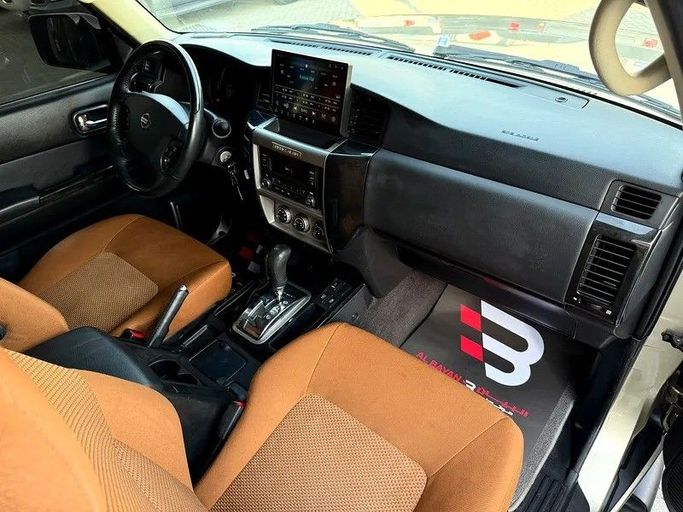Used Nissan Patrol V (Y61) Facelift, 4.8 l, 2021 in Abu Dhabi by Al Bayan Motors, Golden color. GCC Specs | AUTO.AE