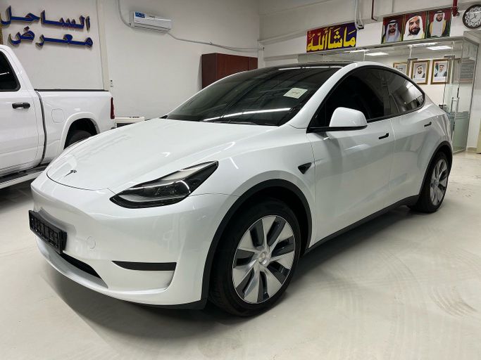 Used Tesla Model Y Standart I, 2024 in Abu Dhabi by Golden coast automobile showroom, White color. GCC Specs | AUTO.AE