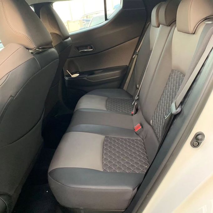 Used Toyota C-HR I Facelift, 1.8 l, 2023 in Abu Dhabi by Al Fajr Automobile showroom, White color. GCC Specs | AUTO.AE