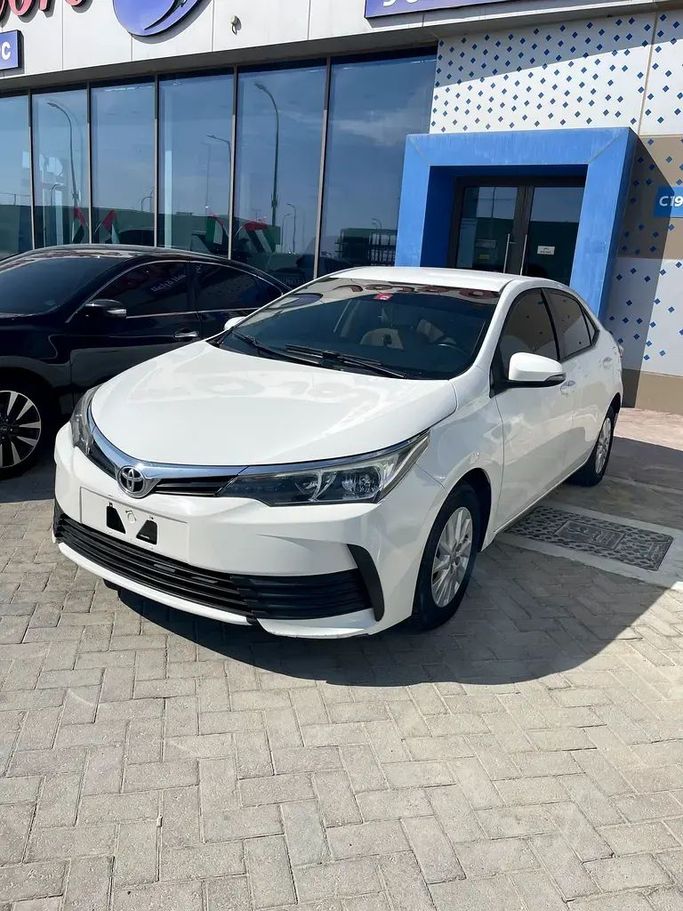 Used Toyota Corolla Sporty XII (E210), 2.0 l, 2019 in Abu Dhabi by Smart Motors Car Trading, White color. GCC Specs | AUTO.AE