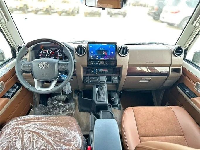 New Toyota Land Cruiser 70 Series Facelift 2, 4.0 l, 2025 in Abu Dhabi by Al Lulu Cars, White color. GCC Specs | AUTO.AE
