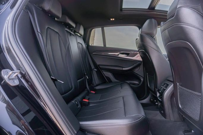 Подержанный BMW X4 M Competition I (F98) Рестайлинг, 3.0 л, 2024 в Аджмане от AMG Cars Черный цвет. Американская | AUTO.AE