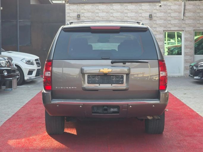 Подержанный Chevrolet Suburban XI, 5.3 л, 2014 в Аджмане от Abu Rashid Cars  Коричневый цвет. GCC | AUTO.AE