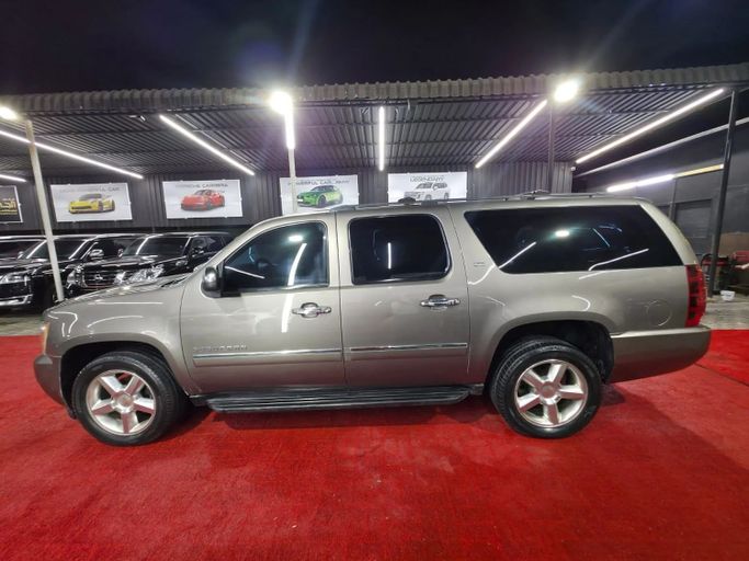 Подержанный Chevrolet Suburban XI, 5.3 л, 2014 в Аджмане от Abu Rashid Cars  Коричневый цвет. GCC | AUTO.AE