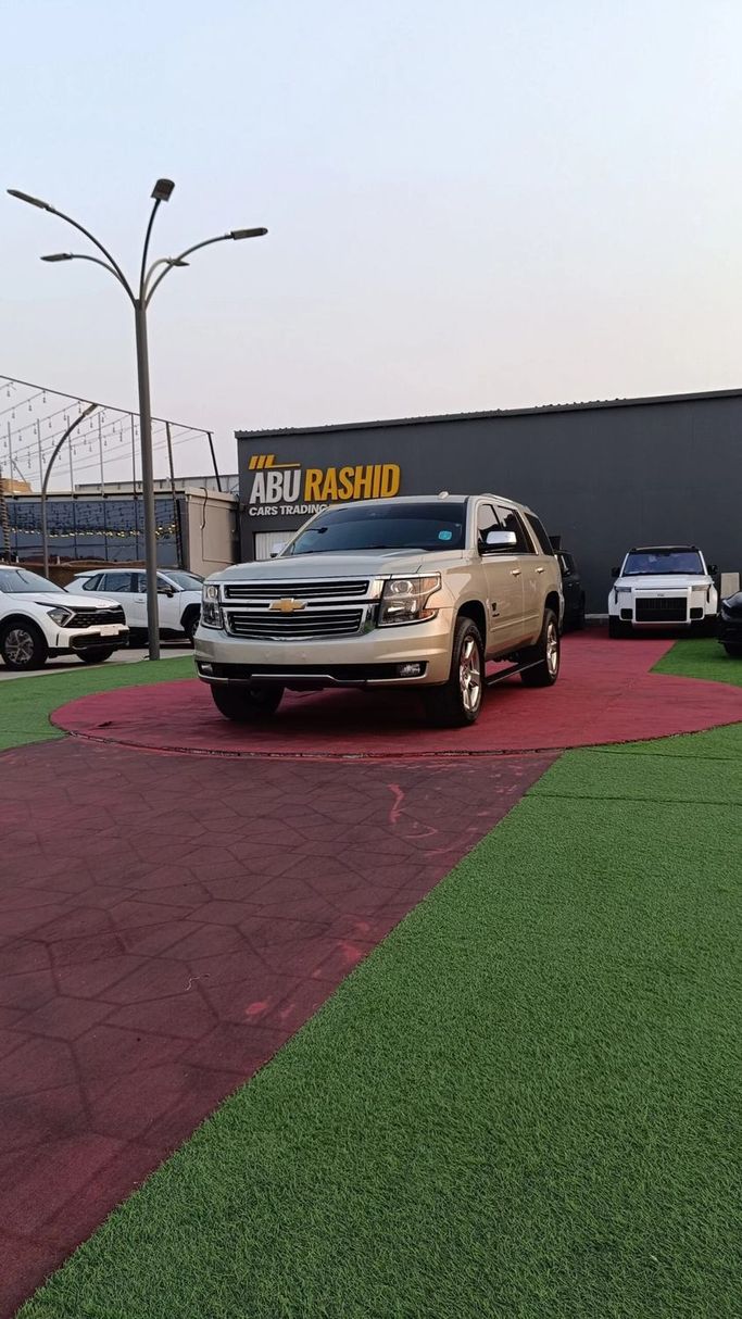 Подержанный Chevrolet Tahoe IV, 5.3 л, 2016 в Аджмане от Abu Rashid Cars  Золотистый цвет. GCC | AUTO.AE