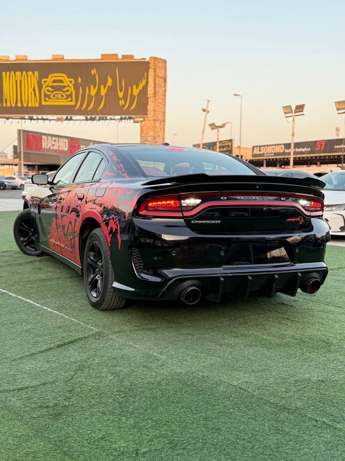 Подержанный Dodge Charger SXT VII (LD) Рестайлинг, 3.6 л, 2020 в Аджмане от Syria Motors Черный цвет.  | AUTO.AE