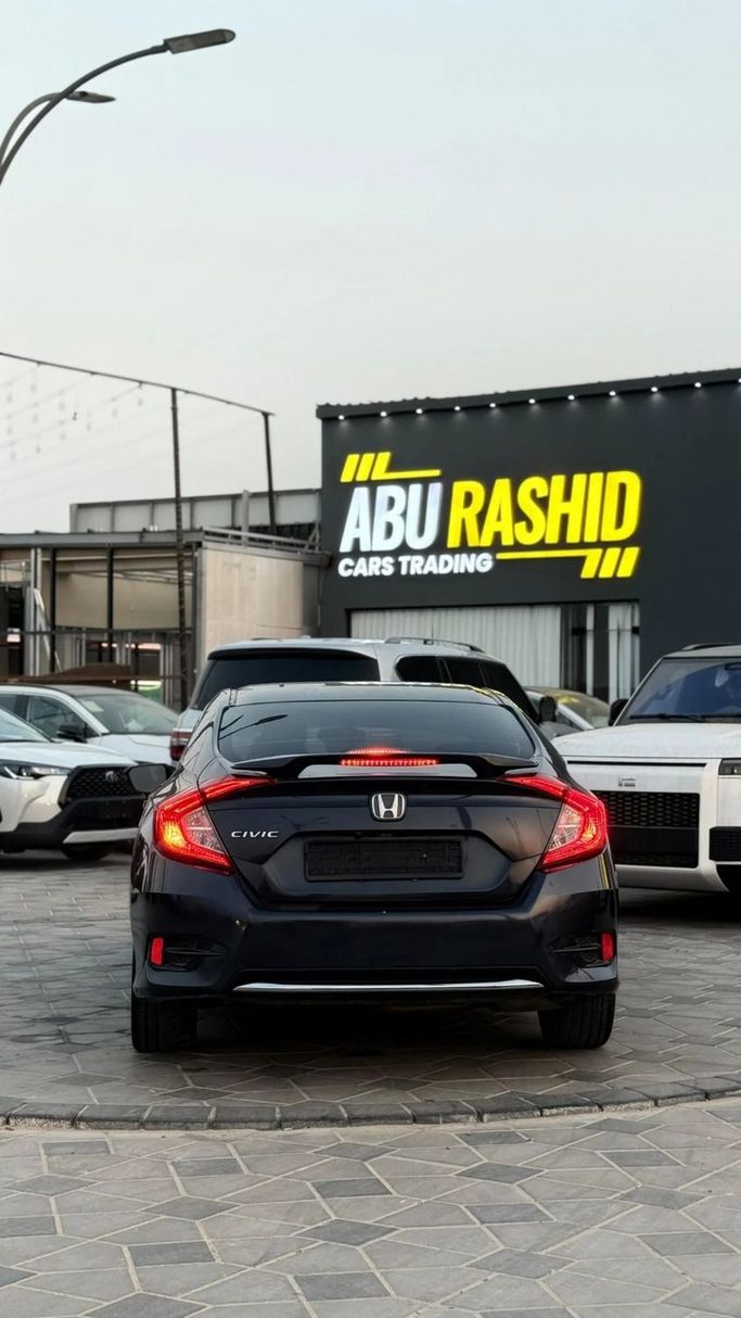 Used Honda Civic X, 2.0 l, 2019 in Ajman by Abu Rashid Cars , Black color. American Specs | AUTO.AE