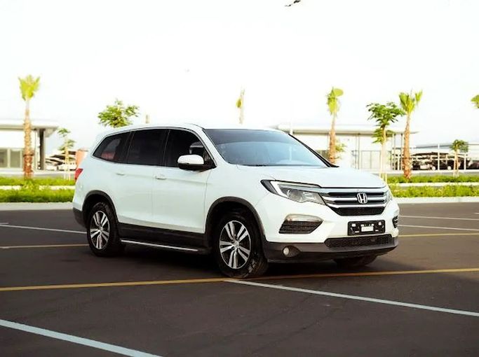 Подержанный Honda Pilot III, 3.0 л, 2016 в Аджмане от EBARIZ AUTO Белый цвет. GCC | AUTO.AE | Объявление #271119