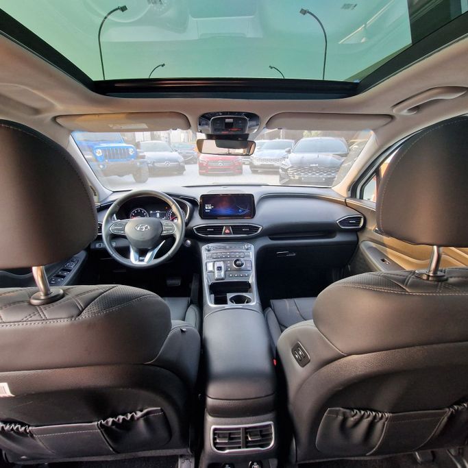 Подержанный Hyundai Santa Fe IV Рестайлинг, 2.2 л, 2023 в Аджмане от Syria Motors Белый цвет. Корейская | AUTO.AE