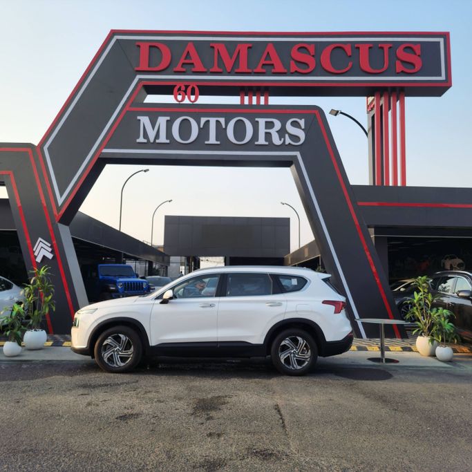 Подержанный Hyundai Santa Fe IV Рестайлинг, 2.2 л, 2023 в Аджмане от Syria Motors Белый цвет. Корейская | AUTO.AE