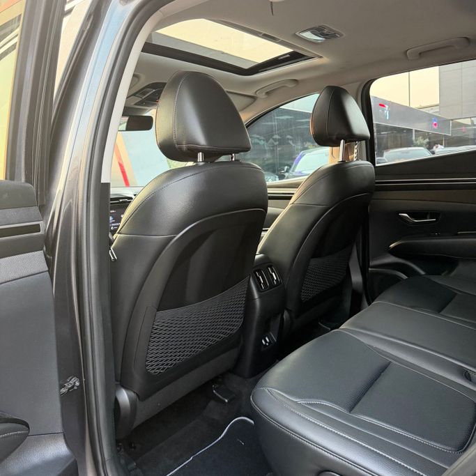 Подержанный Hyundai Tucson IV, 2.5 л, 2023 в Аджмане от Syria Motors Серый цвет. Американская | AUTO.AE