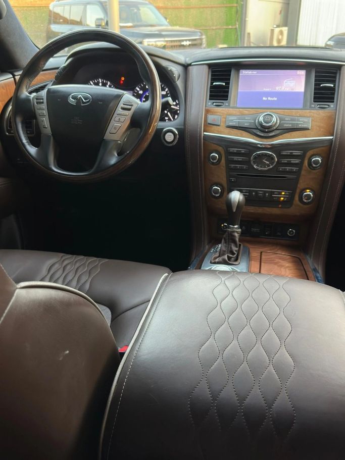 Подержанный Infiniti QX80 I Рестайлинг, 5.6 л, 2015 в Аджмане от Abu Rashid Cars  Белый цвет. Американская | AUTO.AE