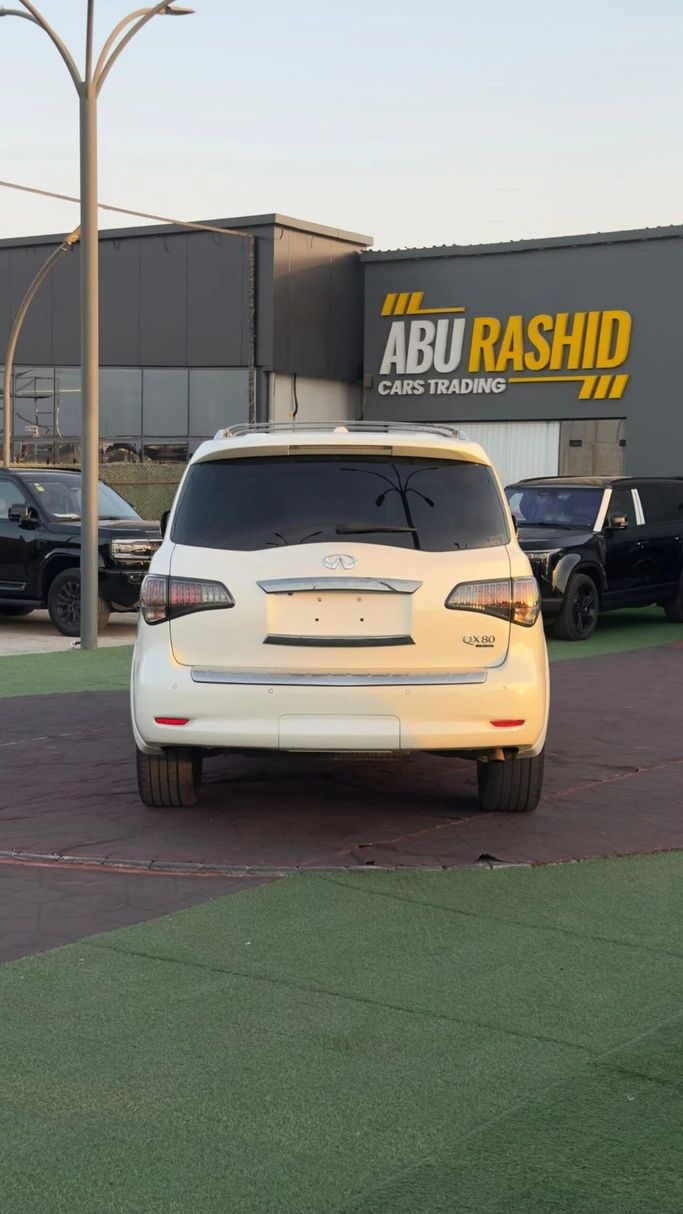 Подержанный Infiniti QX80 I Рестайлинг, 5.6 л, 2015 в Аджмане от Abu Rashid Cars  Белый цвет. Американская | AUTO.AE