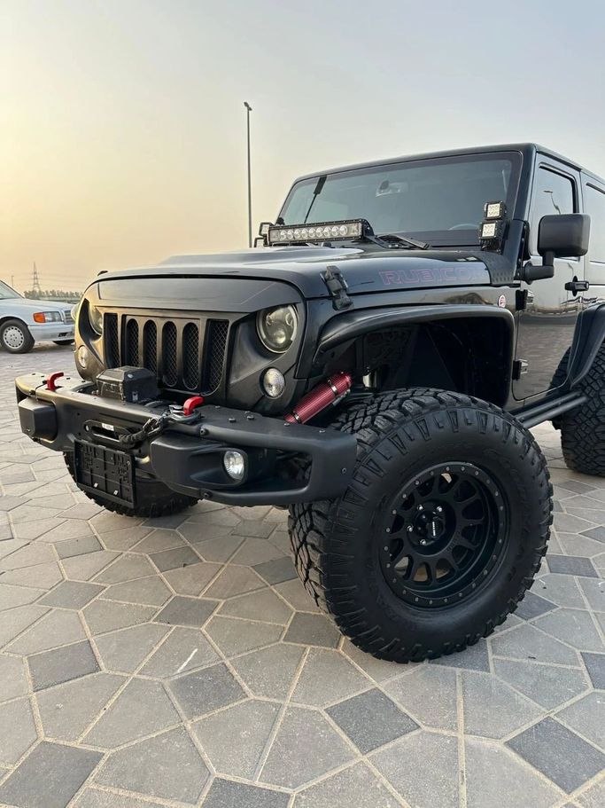 Подержанный Jeep Wrangler III (JK), 3.6 л, 2016 в Аджмане от Abu Rashid Cars  Черный цвет. Американская | AUTO.AE