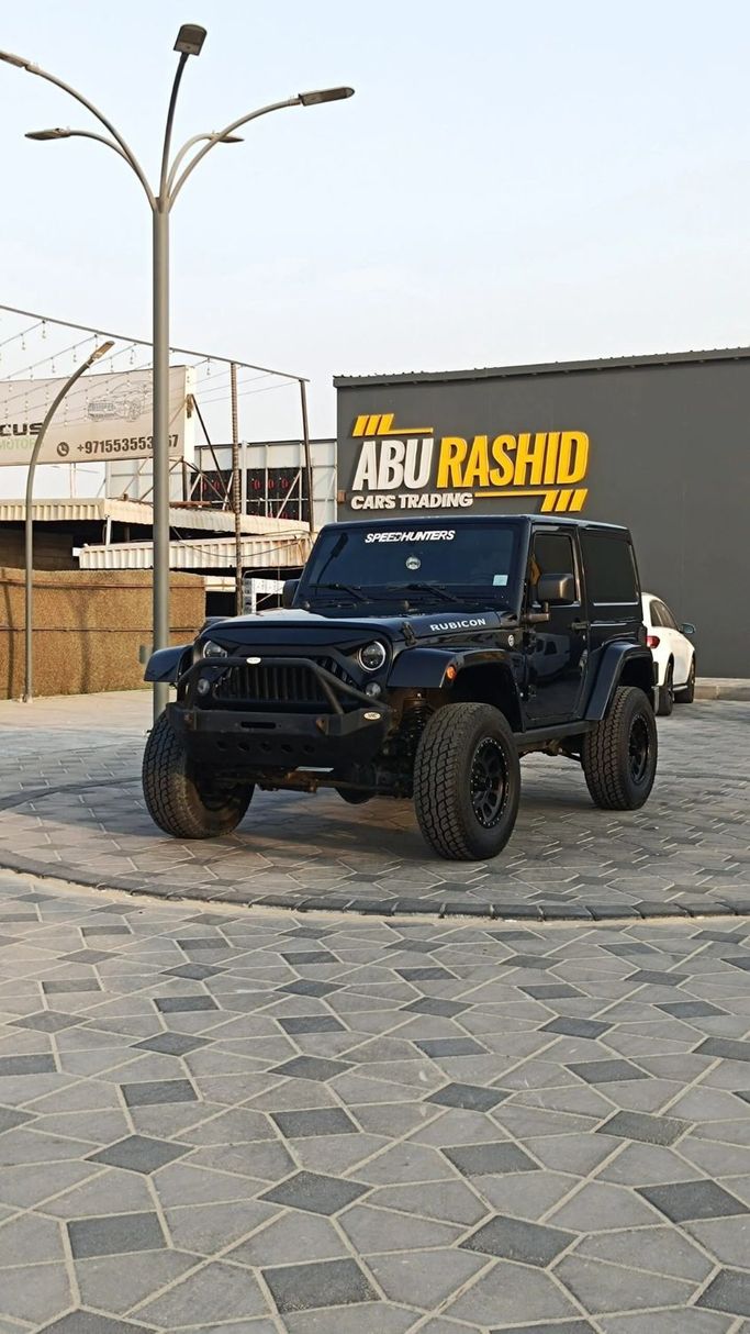 Подержанный Jeep Wrangler III (JK), 3.6 л, 2016 в Аджмане от Abu Rashid Cars  Черный цвет. Китайская | AUTO.AE