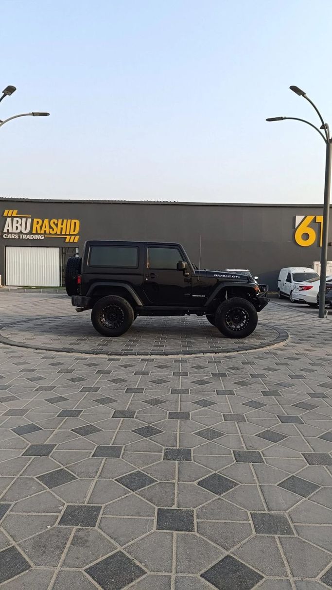 Подержанный Jeep Wrangler III (JK), 3.6 л, 2016 в Аджмане от Abu Rashid Cars  Черный цвет. Китайская | AUTO.AE