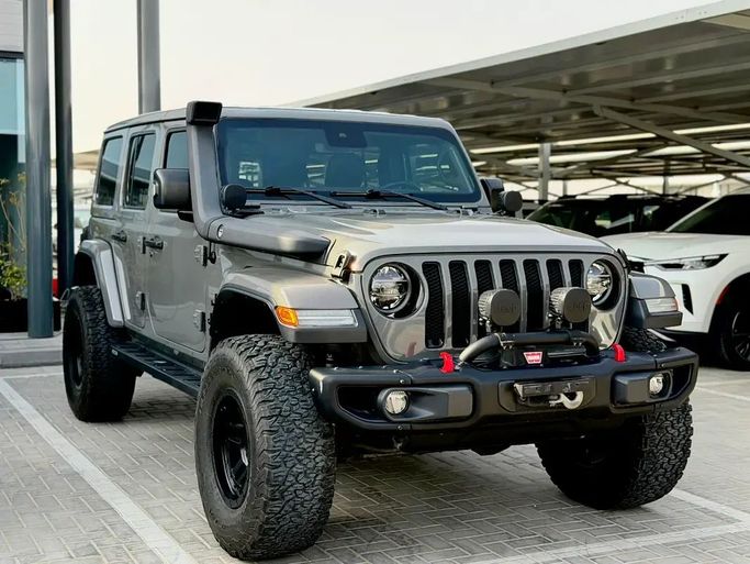 Подержанный Jeep Wrangler IV (JL), 3.6 л, 2019 в Аджмане от MWH MOTORS FZE Серый цвет. GCC | AUTO.AE