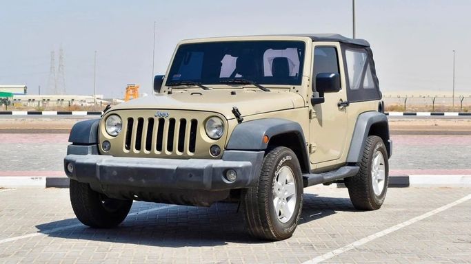 Подержанный Jeep Wrangler IV (JL), 3.6 л, 2017 в Аджмане от DAR AL SAFWA USED CARS Золотистый цвет. Корейская | AUTO.AE