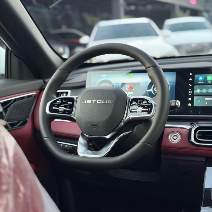 Новый Jetour X70 PLUS I Рестайлинг, 1.6 л, 2025 в Аджмане от Syria Motors Белый цвет. Китайская | AUTO.AE