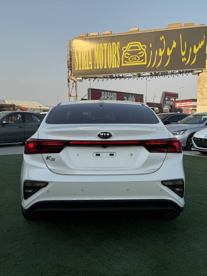 Подержанный Kia K3 II, 1.6 л, 2020 в Аджмане от Syria Motors Белый цвет.  | AUTO.AE