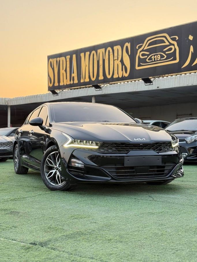 Подержанный Kia K5 III, 2.0 л, 2023 в Аджмане от Syria Motors Черный цвет. Корейская | AUTO.AE