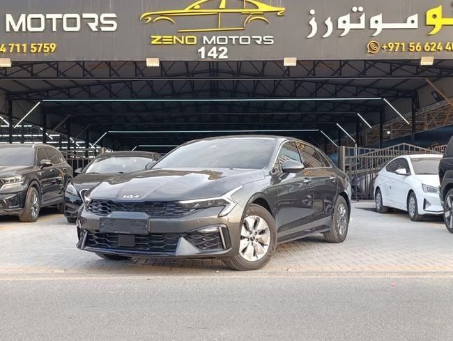 Подержанный Kia K5 III Рестайлинг, 2.0 л, 2025 в Аджмане от Zeno Motors Fze Серый цвет. Корейская | AUTO.AE