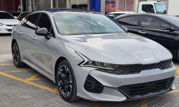 Used Kia K5 III, 1.6 l, 2023 in Ajman by Al Hilal Motors, Grey color. American Specs | AUTO.AE | Listing #261249