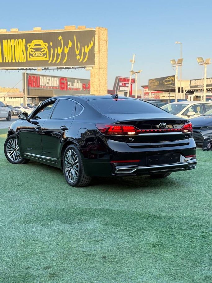 Подержанный Kia K7 YG (II) Рестайлинг, 3.0 л, 2021 в Аджмане от Syria Motors Черный цвет. Корейская | AUTO.AE
