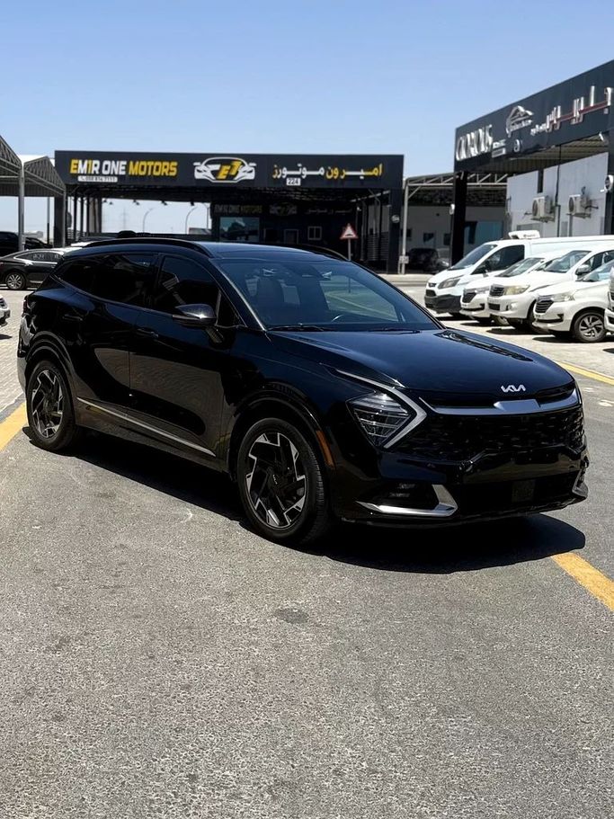 Used Kia Sportage V, 2.5 l, 2023 in Ajman by Al Hilal Motors, Black color. American Specs | AUTO.AE