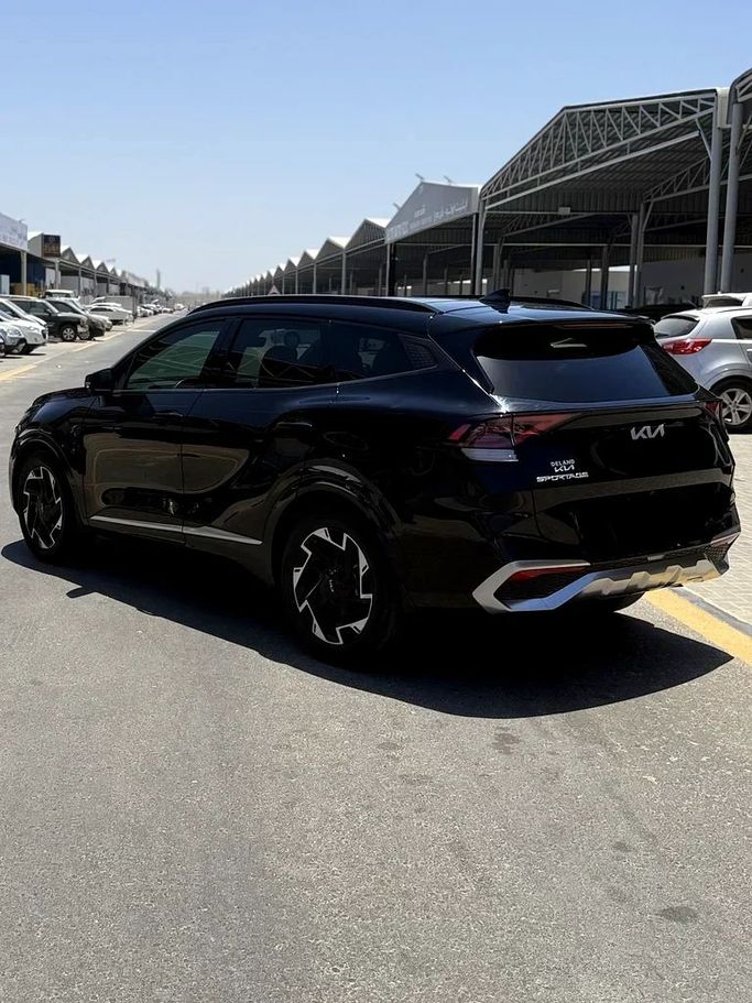 Used Kia Sportage V, 2.5 l, 2023 in Ajman by Al Hilal Motors, Black color. American Specs | AUTO.AE