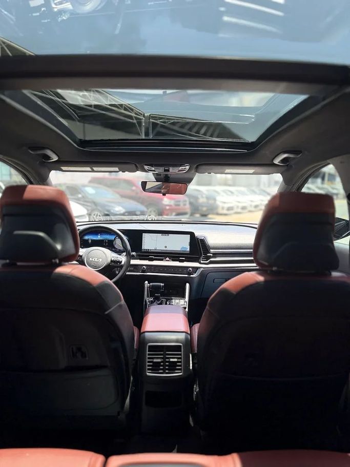 Used Kia Sportage V, 2.5 l, 2023 in Ajman by Al Hilal Motors, Black color. American Specs | AUTO.AE