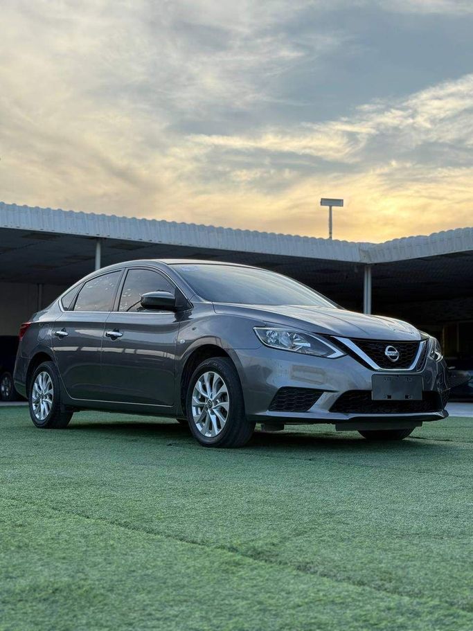 مستعملة Nissan Sentra ثامناً (B18), 2.0 l, 2021 في في عجمان من Syria Motors، اللون رمادي. المواصفات اليابانية | AUTO.AE