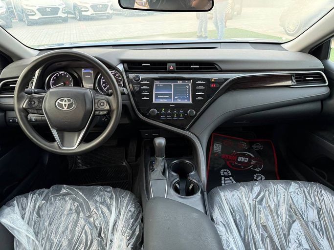 Подержанный Toyota Camry VIII (XV70), 2.5 л, 2020 в Аджмане от Syria Motors Синий цвет. Американская | AUTO.AE